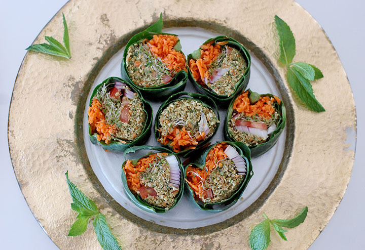 The Global Girl Raw Food Recipes: Raw Wrap with Pumpkin Seed & Mint Patty in a collard green leaf with tomato, shredded carrot, red onion and clover sprouts.