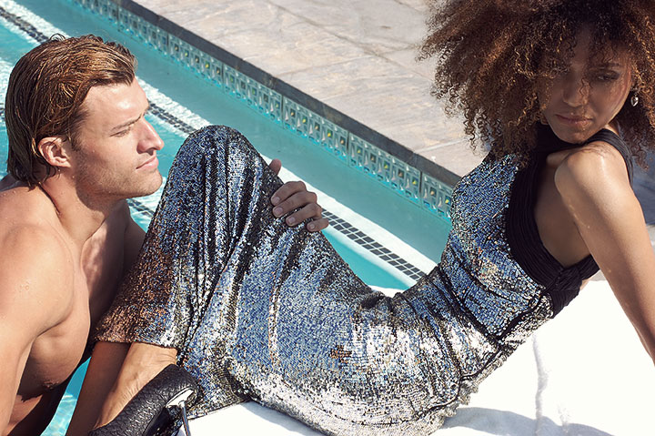 The Global Girl Fashion Cinema Series: In this scene shot at the Thompson Beverly Hills rooftop swimming pool on the set of The Global Girl's new film Second Chance, Ndoema sports a silver sequin halter mermaid dress by Australian designer Rachel Gilbert, snake platform pumps with silver metal heels by Monika Chiang and Swarovski Crystal-studded ear cuffs by Monika Chiang