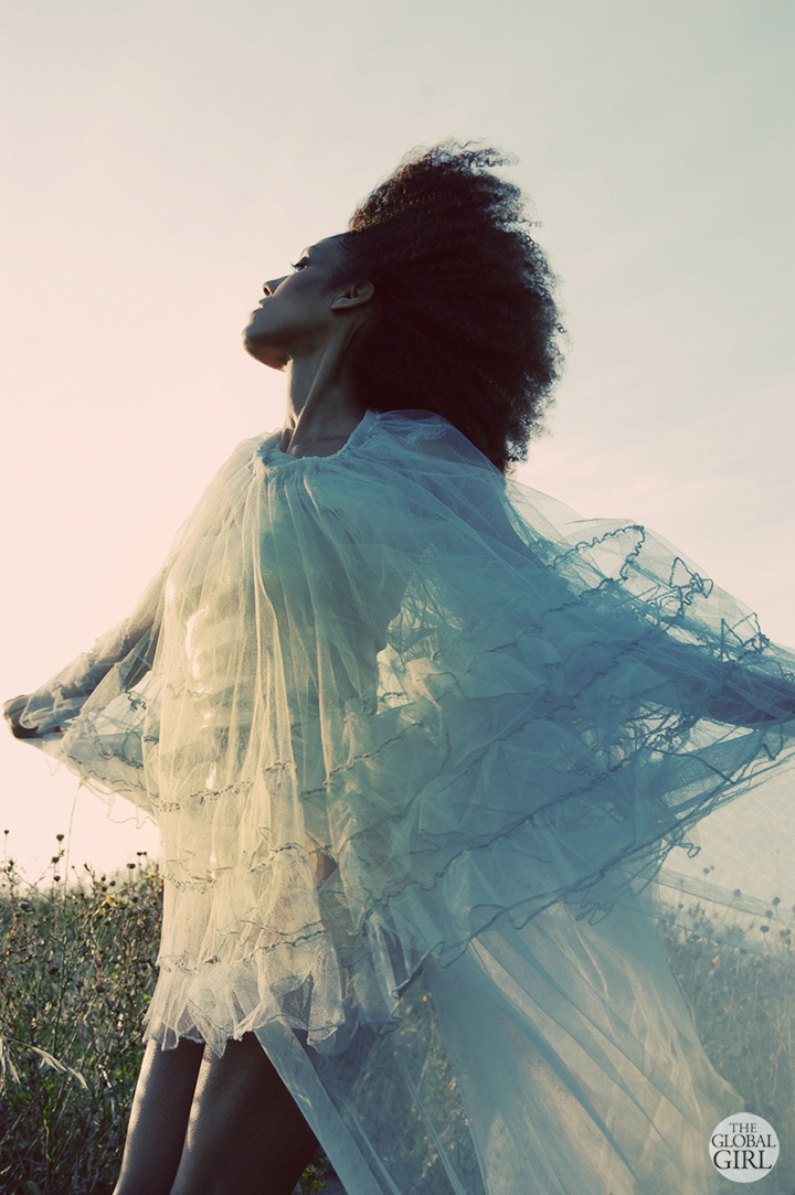 The Global Girl Fashion Editorials: In this fairy tale inspired photoshoot, Ndoema limbers up for a dance in in a fairy tale worthy vintage blue tulle dress.