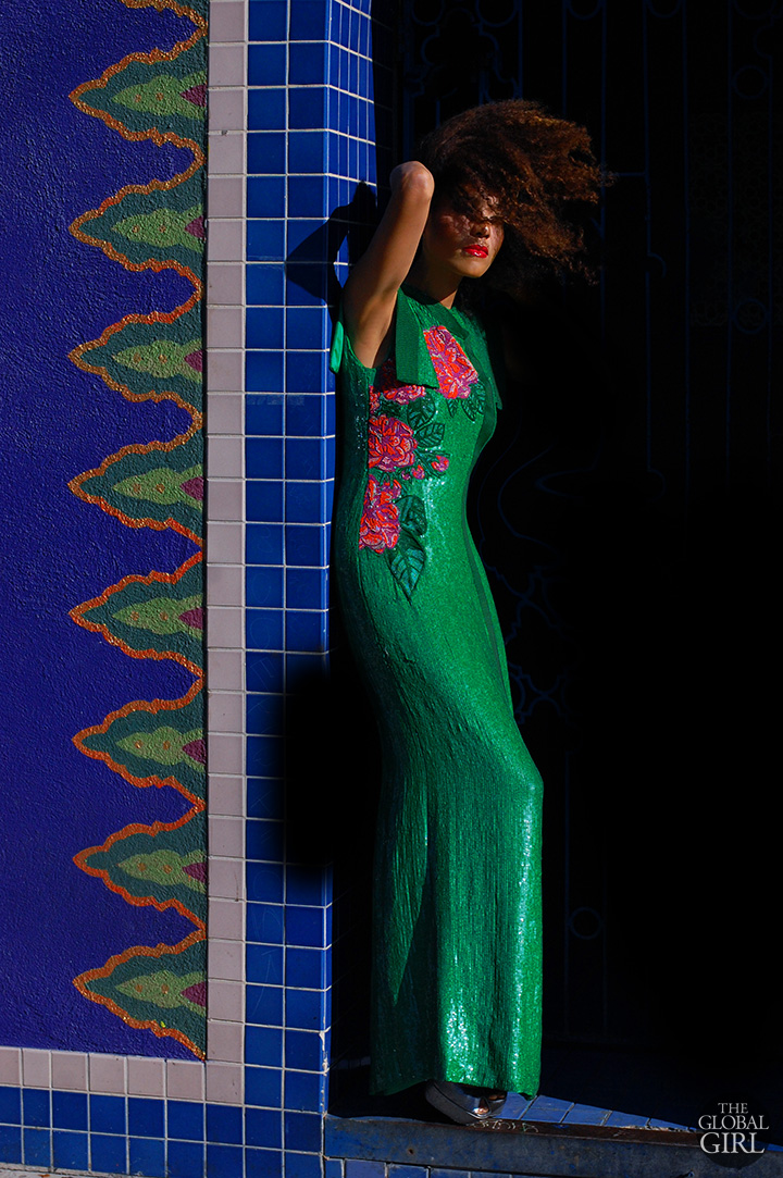 The Global Girl Fashion Editorials: Ndoema sports an Asian-inspired emerald green sequin evening dress with hand-beaded rose embellishment by African fashion designer Mimi Plange.