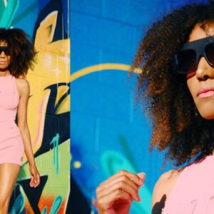 Ndoema sports a pink Versace dress, Phillip Lim sunglasses, Paola Graglia Bag and Report Signature floral high heel shoes