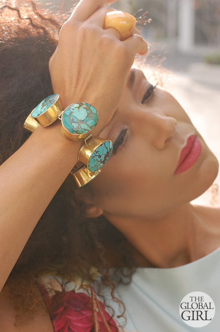 Ndoema wears a custom turquoise and brass oversized bracelet with yellow agate ring.